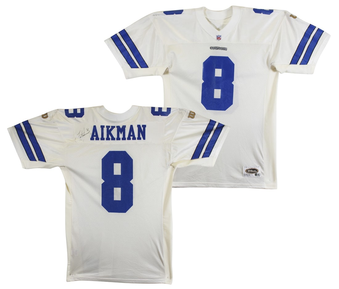 Troy Aikman Signed Dallas Cowboys Authentic Jersey Beckett BAS: Troy Aikman Signed Dallas Cowboys Authentic Jersey Beckett BAS This authentic white Wilson jersey has been personally signed by Troy Aikman, a legendary player of the Dallas Cowboys. The jersey is an 