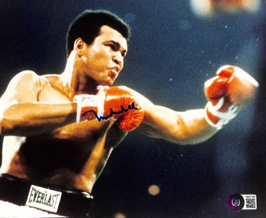 Muhammad Ali Signed 8x10 Photo with Beckett LOA: Muhammad Ali Signed 8x10 Photo with Beckett LOA This is an original, autographed 8x10 color photograph of boxing legend Muhammad Ali, signed in blue permanent marker. The signature has been authentica