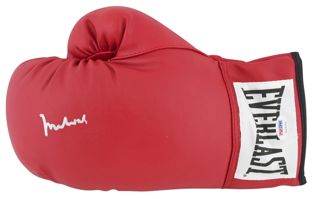 Muhammad Ali Signed Red Everlast Boxing Glove PSA/DNA Authenticated: Muhammad Ali Signed Red Everlast Boxing Glove PSA/DNA Authenticated This authentic red Everlast boxing glove has been personally signed by the legendary Muhammad Ali, a true icon of the sport. This it