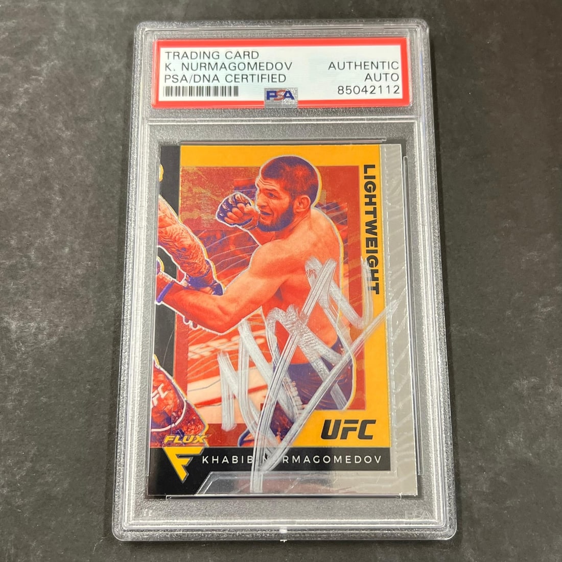 2021 Panini Chronicles Flux Khabib Nurmagomedov Signed Card PSA Authenticated: 2021 Panini Chronicles Flux Khabib Nurmagomedov Signed Card PSA Authenticated This is a 2021 Panini Chronicles Flux #250 sports trading card featuring Khabib Nurmagomedov, a prominent figure in the Ul