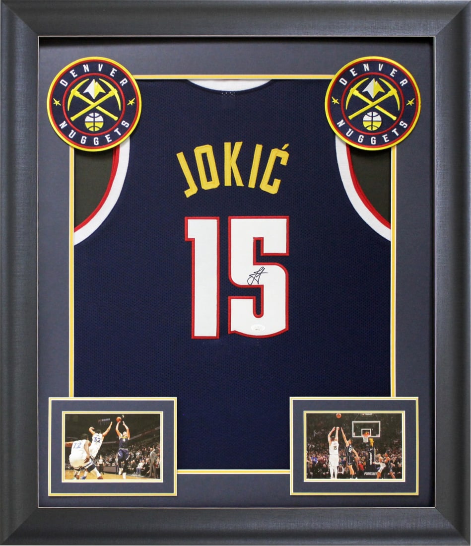 Framed Nikola Jokic Signed Navy Pro Style Jersey with JSA COA: Framed Nikola Jokic Signed Navy Pro Style Jersey with JSA COA This framed navy blue pro style jersey has been personally signed by Nikola Jokic of the Denver Nuggets. The jersey is custom-stitched, no