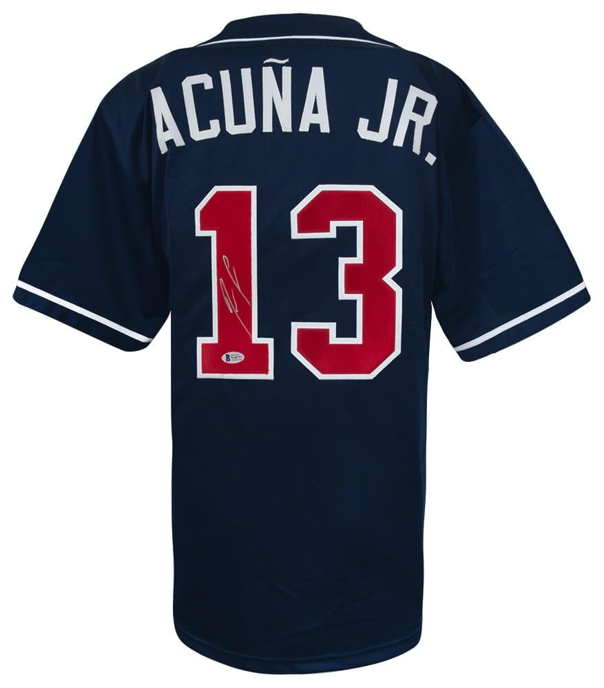 Ronald Acuna Jr. Signed Navy Custom Jersey with Beckett COA: Ronald Acuna Jr. Signed Navy Custom Jersey with Beckett COA This authentic navy custom baseball jersey is signed by Ronald Acuna Jr., a standout player for the Atlanta Braves. The jersey features a Be