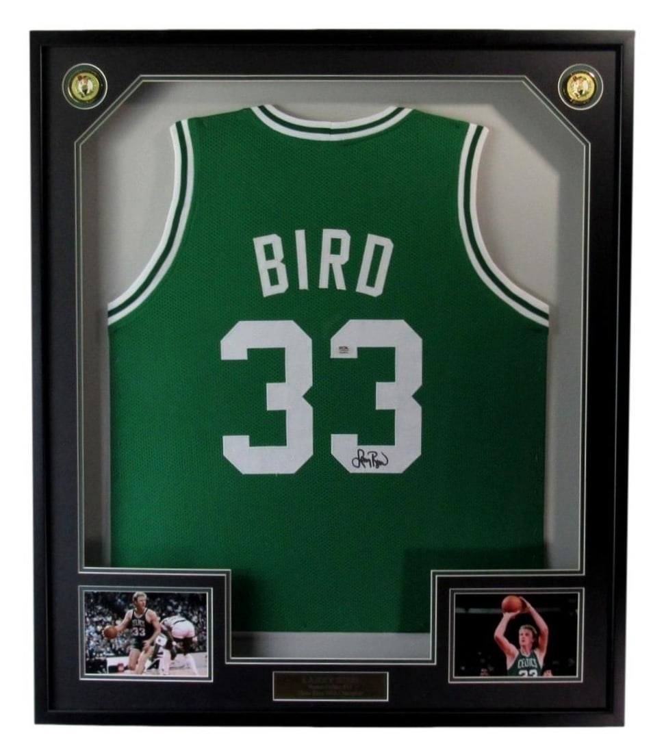 Framed Larry Bird Autographed Celtics Basketball Jersey PSA DNA Authenticated: Framed Larry Bird Autographed Celtics Basketball Jersey PSA DNA Authenticated This framed Boston Celtics basketball jersey features the signature of Hall of Famer Larry Bird. The jersey is authenticat