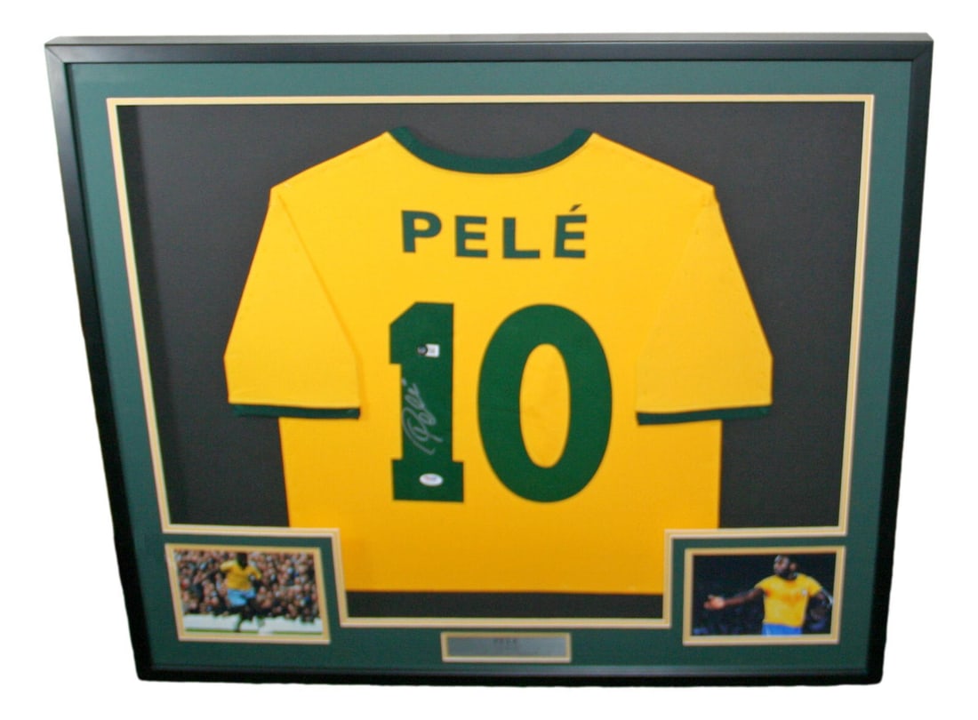 Pele Signed Framed Brazil Soccer Jersey PSA Authenticated: Pele Signed Framed Brazil Soccer Jersey PSA Authenticated This is a framed jersey featuring the legendary soccer player Pele. The jersey is an original piece authenticated by the Professional Sports A