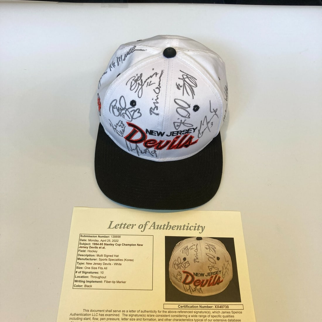 1995 New Jersey Devils Signed Cap with Bill Clinton JSA Certified: 1995 New Jersey Devils Signed Cap with Bill Clinton JSA Certified Celebrate the New Jersey Devils' historic 1995 Stanley Cup Championship with this signed cap, featuring the signatures of key players 