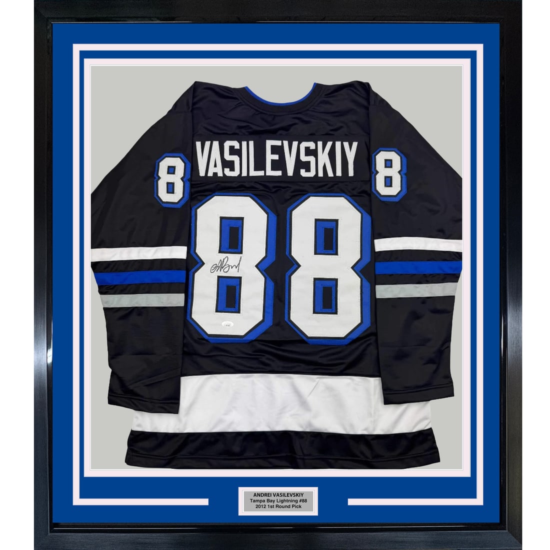 Framed Signed Andrei Vasilevskiy Jersey 35x39 JSA COA Tampa Bay Lightning: Framed Signed Andrei Vasilevskiy Jersey 35x39 JSA COA Tampa Bay Lightning This professionally framed autographed Andrei Vasilevskiy black hockey jersey is a must-have for any Tampa Bay Lightning fan. 