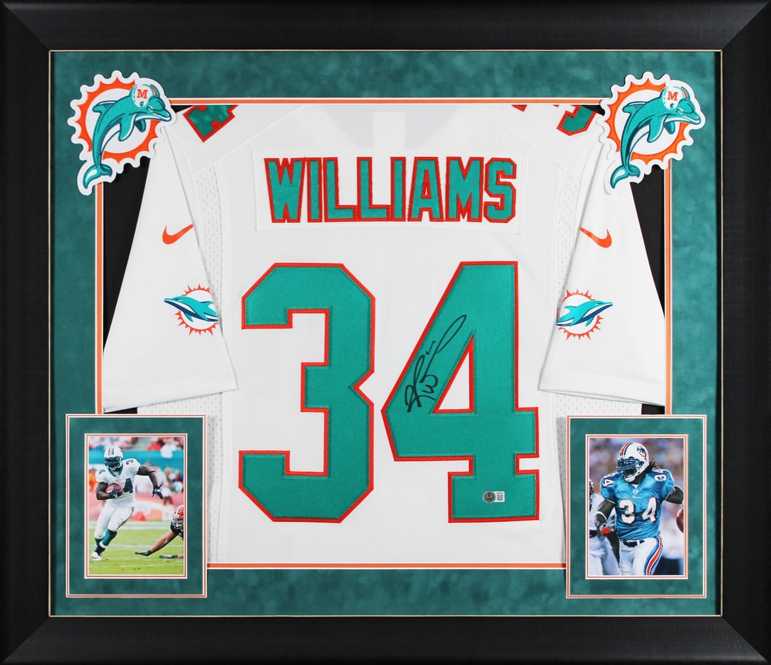 Framed Ricky Williams Miami Dolphins signed Nike Limited jersey BAS witnessed: Framed Ricky Williams Miami Dolphins signed Nike Limited jersey BAS witnessed This professionally framed white Nike Limited Miami Dolphins jersey features the authentic signature of Ricky Williams. Th