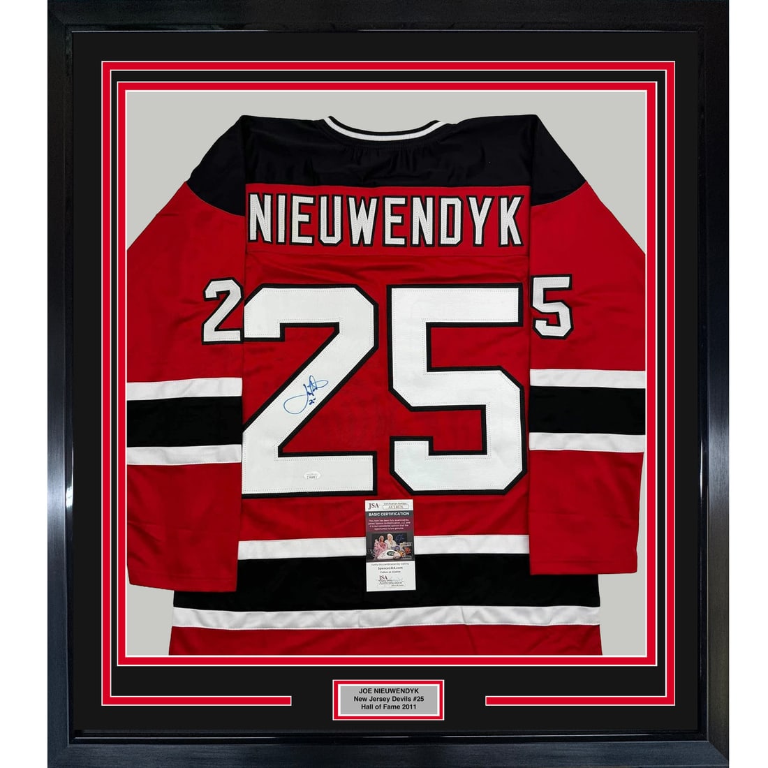 Joe Nieuwendyk signed Devils jersey display 35x39 JSA COA: Joe Nieuwendyk signed Devils jersey display 35x39 JSA COA This professionally framed and matted display features a New Jersey Devils red jersey autographed by Joe Nieuwendyk. The piece includes two 5x
