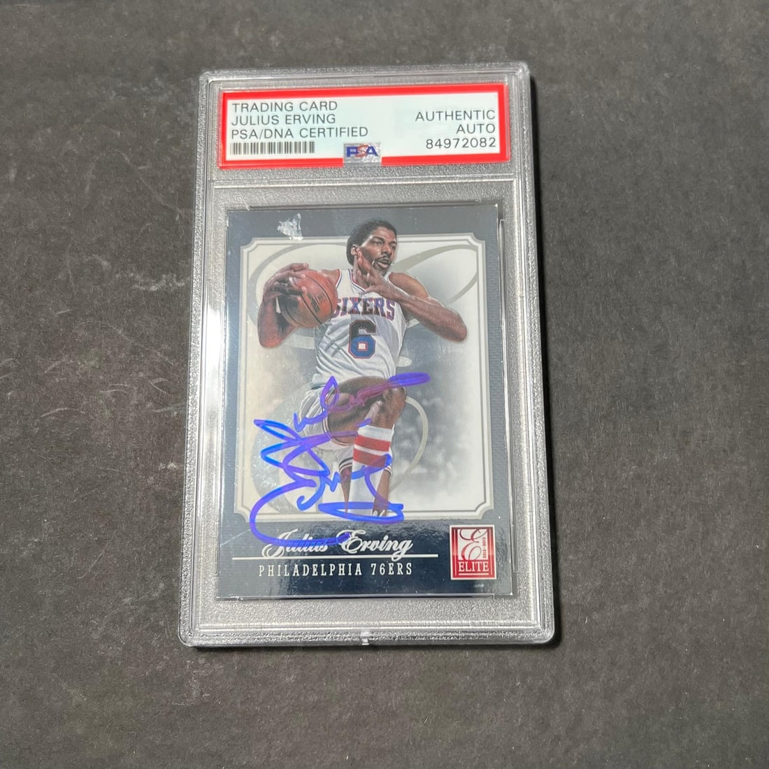 2012-13 Panini Elite Julius Erving Signed Card PSA Authenticated #181: 2012-13 Panini Elite Julius Erving Signed Card PSA Authenticated #181 This is a 2012-13 Panini Elite #181 Julius Erving autographed sports trading card. The card features the legendary NBA player Juli