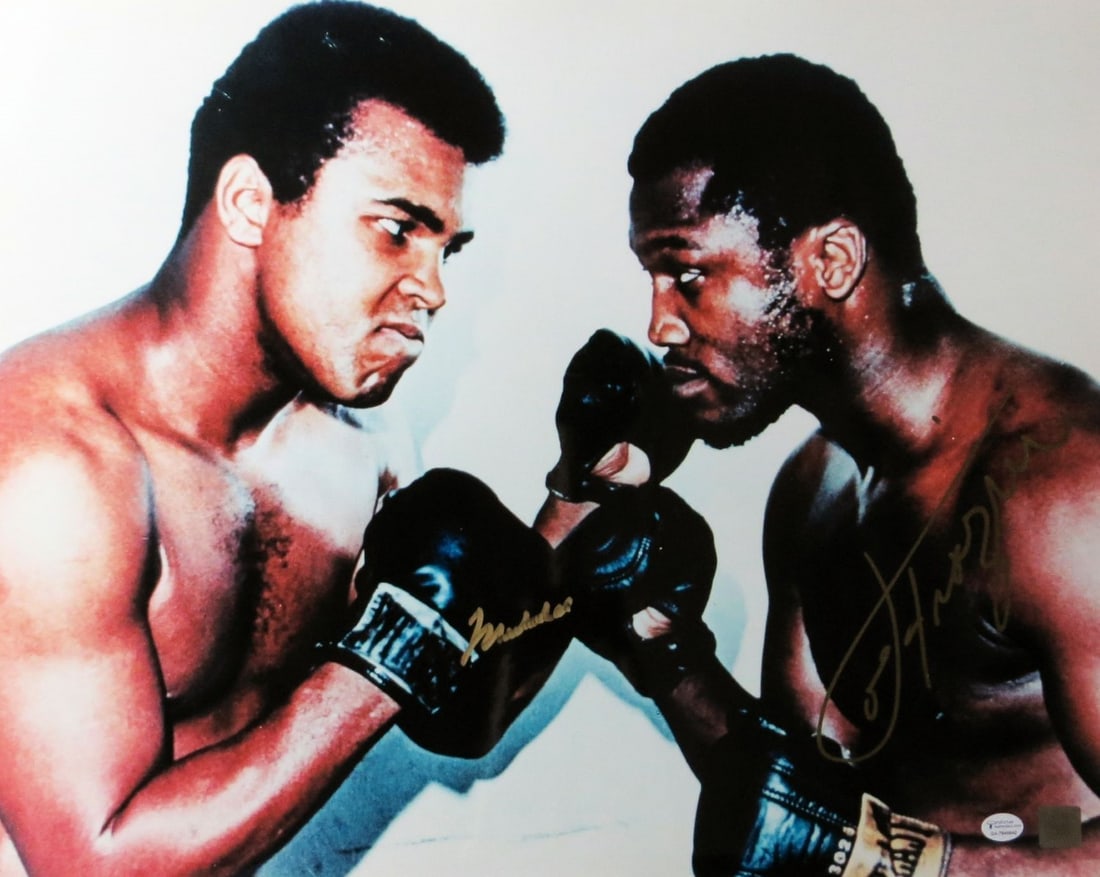Muhammad Ali Joe Frazier Autographed 16x20 Boxing Photo Online Authentics: Muhammad Ali Joe Frazier Autographed 16x20 Boxing Photo Online Authentics This striking 16X20 photo captures the legendary moment of Muhammad Ali and Joe Frazier posing with their gloves, showcasing t