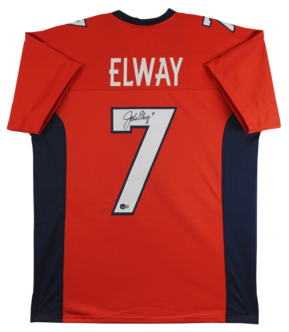John Elway Signed Denver Broncos Orange/Navy Jersey BAS Witnessed: John Elway Signed Denver Broncos Orange/Navy Jersey BAS Witnessed This authentic Orange/Navy Pro Style Jersey has been personally signed by NFL legend John Elway, showcasing his signature in a unique 
