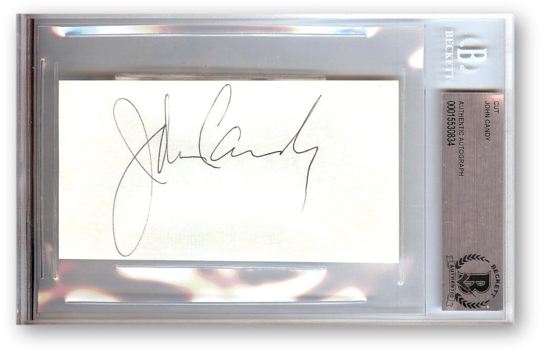 Beckett Authenticated John Candy Cut Autograph Slabbed Signature: Beckett Authenticated John Candy Cut Autograph Slabbed Signature This is an original cut signature card autographed by John Candy, known for his roles on SCTV and in the film Uncle Buck. The autograph