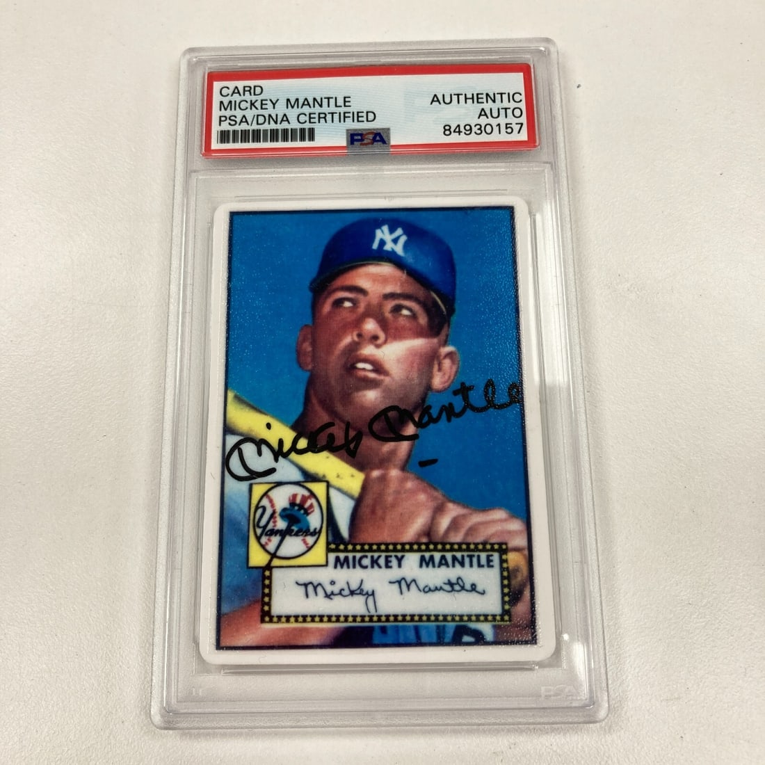 1952 Topps Mickey Mantle Signed Baseball Card PSA Certified: 1952 Topps Mickey Mantle Signed Baseball Card PSA Certified This is a rare 1952 Topps Mickey Mantle Signed Porcelain Baseball Card, featuring the legendary player Mickey Mantle. The card is hard signe