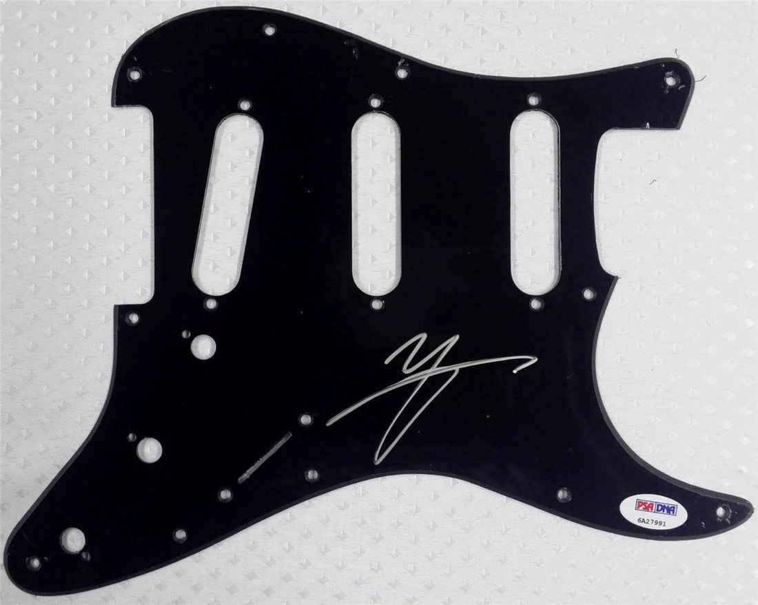 Motley Crue Vince Neil autographed guitar pickguard with PSA/DNA witness certificate: Motley Crue Vince Neil autographed guitar pickguard with PSA/DNA witness certificate This original guitar pickguard is signed by Vince Neil of Motley Crue. The autograph has been authenticated by PSA/