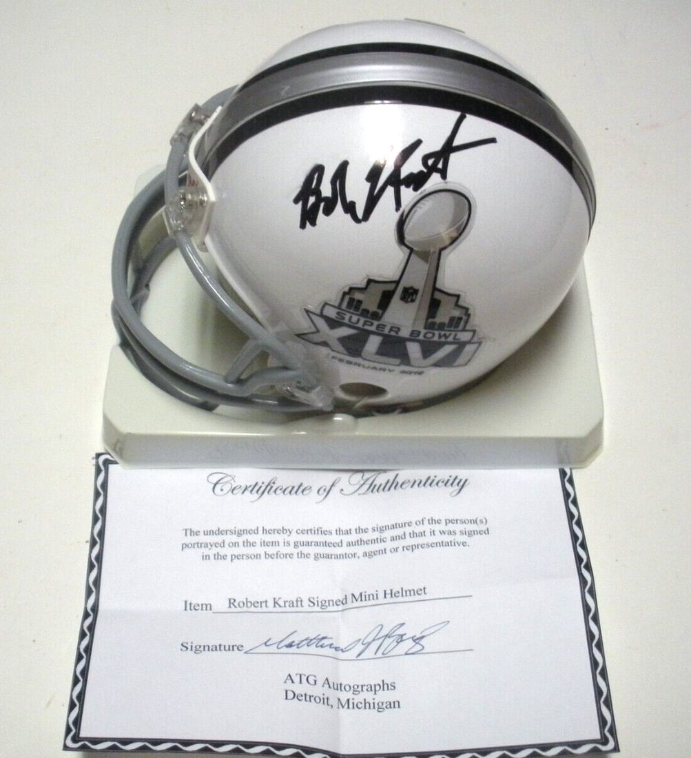 Signed Mini Helmet by Robert Kraft with COA New England Patriots 7X Champions: Signed Mini Helmet by Robert Kraft with COA New England Patriots 7X Champions This is a pre-owned mini helmet signed by Robert Kraft, commemorating the New England Patriots as 7-time Super Bowl champi
