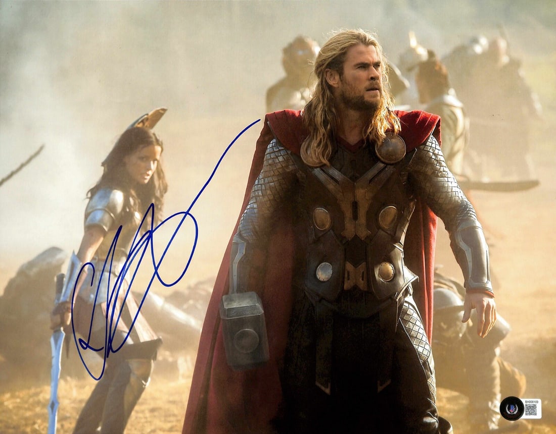 Chris Hemsworth Thor Signed 11x14 Photo Beckett Certified: Chris Hemsworth Thor Signed 11x14 Photo Beckett Certified This impressive 11x14 color photograph features Chris Hemsworth as Thor, signed in blue permanent marker. The autograph is authenticated by Be