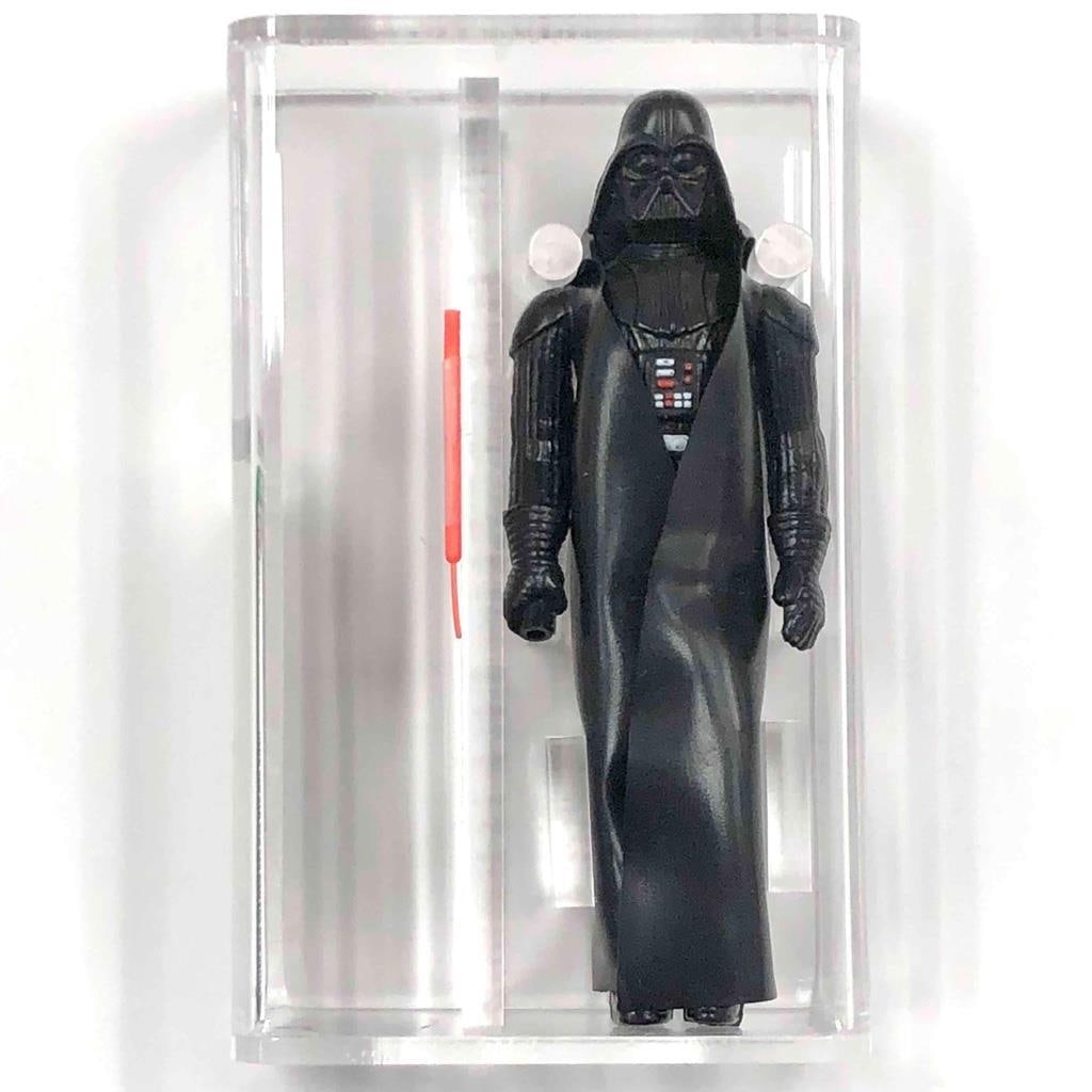 AFA 85 Darth Vader 1977 Star Wars Action Figure with Lightsaber Hong Kong: AFA 85 Darth Vader 1977 Star Wars Action Figure with Lightsaber Hong Kong This is an original 1977 Star Wars Darth Vader action figure produced by Kenner. Graded 85 by the Action Figure Authority (AFA
