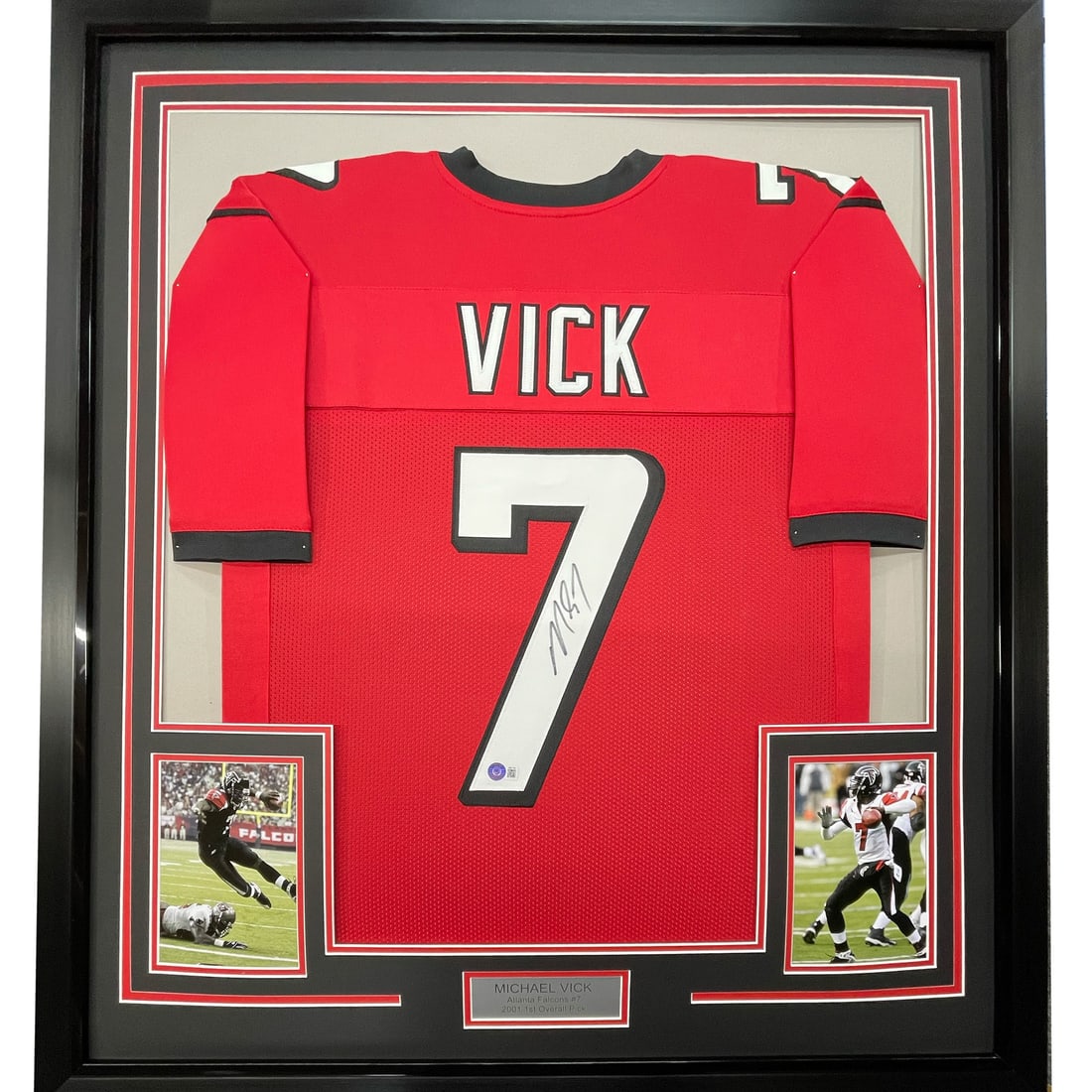 Framed Autographed Michael Vick Atlanta Falcons Jersey PSA/DNA COA 33x42: Framed Autographed Michael Vick Atlanta Falcons Jersey PSA/DNA COA 33x42 Celebrate the legacy of Michael Vick with this professionally framed autographed Atlanta Falcons red jersey. This stunning piec