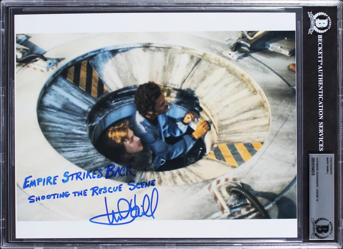Mark Hamill Signed 8x10 Star Wars Rescue Scene Photo BAS Authenticated: Mark Hamill Signed 8x10 Star Wars Rescue Scene Photo BAS Authenticated This stunning 8x10 photograph captures Mark Hamill in a memorable moment from "The Empire Strikes Back" during the rescue scene. 