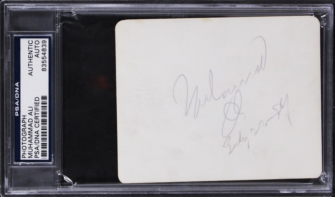 PSA DNA Slabbed Muhammad Ali Autographed 3.5x4.25 Photo: PSA DNA Slabbed Muhammad Ali Autographed 3.5x4.25 Photo Autographed 3.5x4.25 photo personally signed by Muhammad Ali. The item is original, slabbed, and authenticated by PSA/DNA. It is listed in pre-o