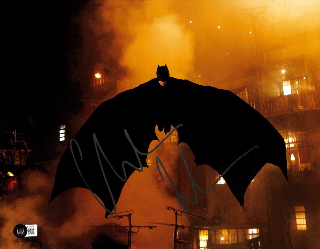 Christian Bale Signed 11x14 Batman Begins Photo Beckett Certified: Christian Bale Signed 11x14 Batman Begins Photo Beckett Certified This striking 11x14 photograph features Christian Bale as Batman from the iconic film "Batman Begins." The photo is autographed in sil