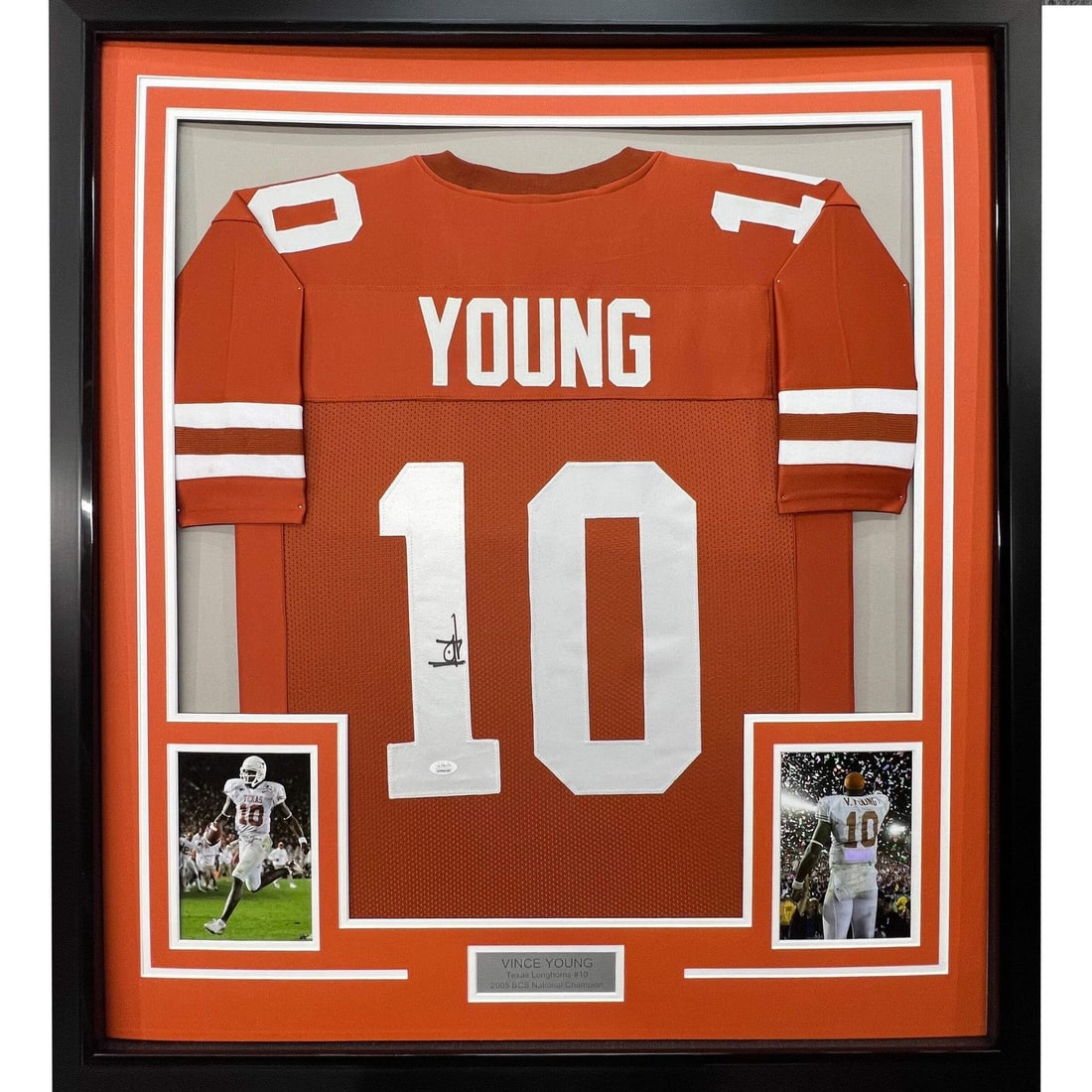 Framed Vince Young Texas Longhorns Jersey JSA COA 33x42: Framed Vince Young Texas Longhorns Jersey JSA COA 33x42 This professionally framed and matted Texas Longhorns jersey features the authentic autograph of Vince Young. The display includes two 8x10 phot
