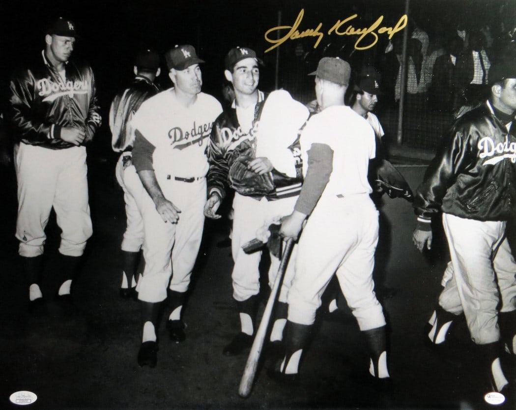 Sandy Koufax Autographed 16x20 Dodgers Photo JSA Certified: Sandy Koufax Autographed 16x20 Dodgers Photo JSA Certified This is an original 16x20 photo of Sandy Koufax, featuring his autograph. The photo captures the iconic Dodgers locker room, showcasing a mom