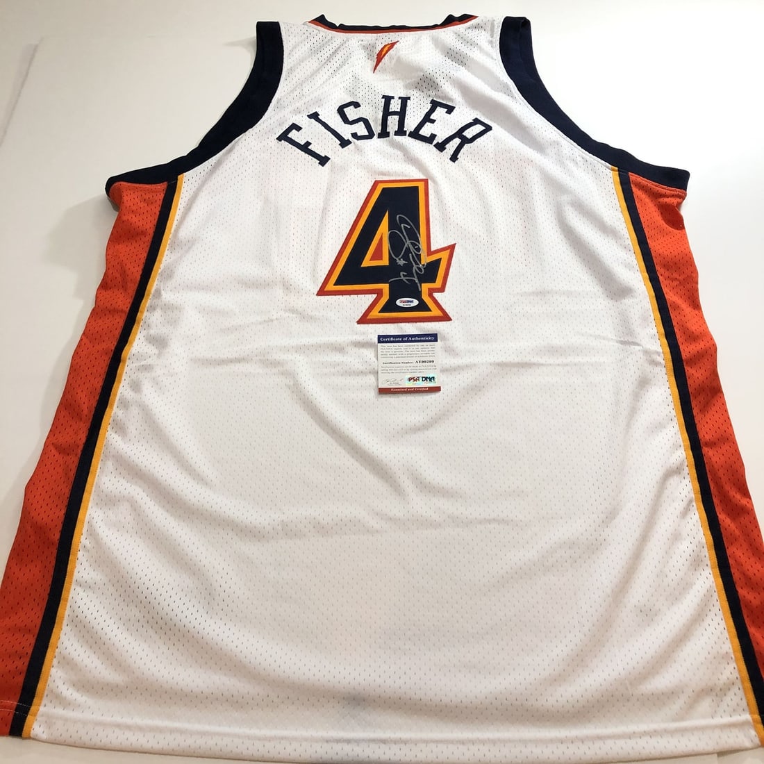 Derek Fisher Autographed Jersey PSA/DNA Golden State Warriors: Derek Fisher Autographed Jersey PSA/DNA Golden State Warriors This is an original jersey autographed by Derek Fisher, the renowned basketball player who played for the Golden State Warriors. The signa