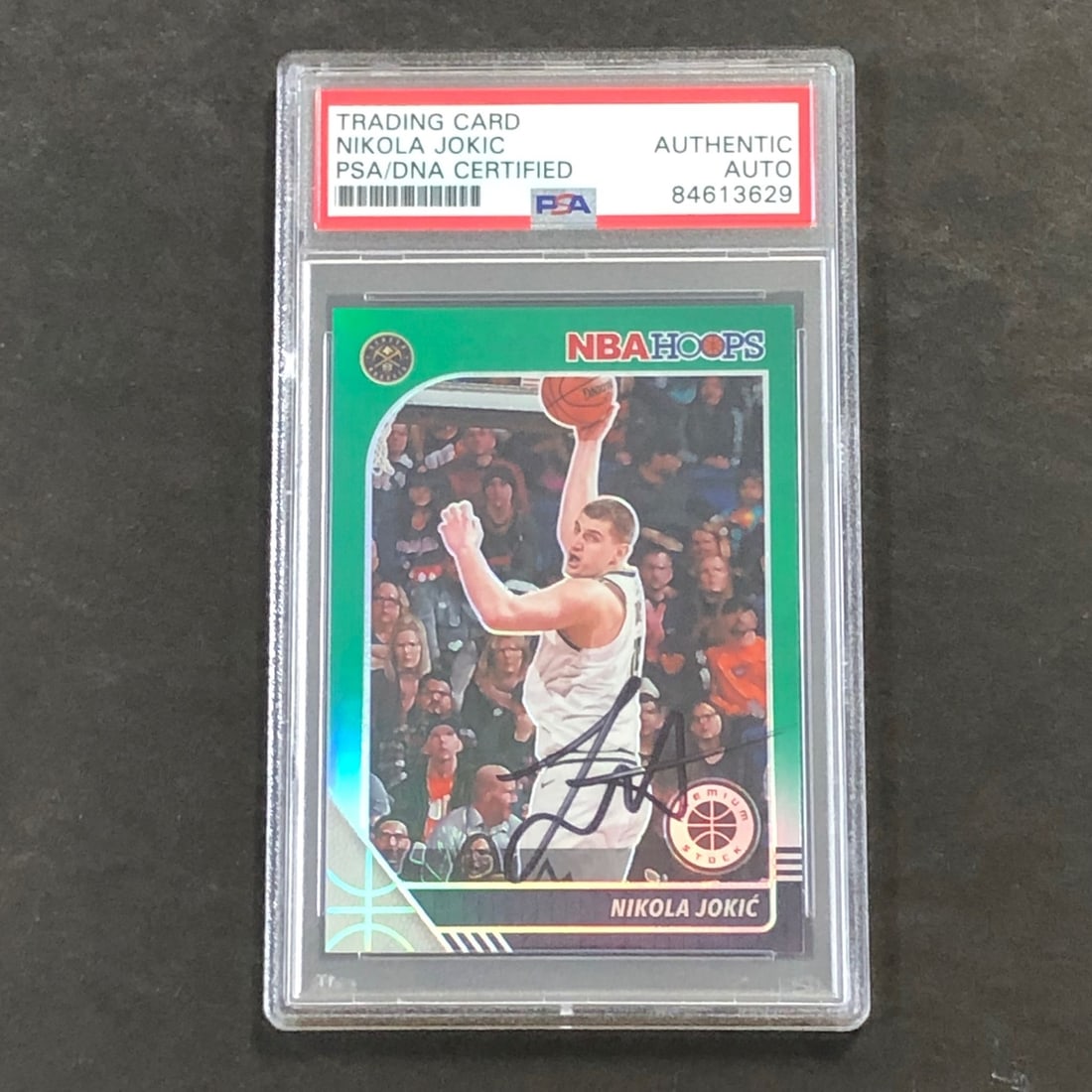 2019-20 NBA Hoops #47 Nikola Jokic Signed Card PSA Authenticated Nuggets: 2019-20 NBA Hoops #47 Nikola Jokic Signed Card PSA Authenticated Nuggets This collectible features a 2019-20 NBA Hoops #47 trading card signed by Nikola Jokic, the star player for the Denver Nuggets. 