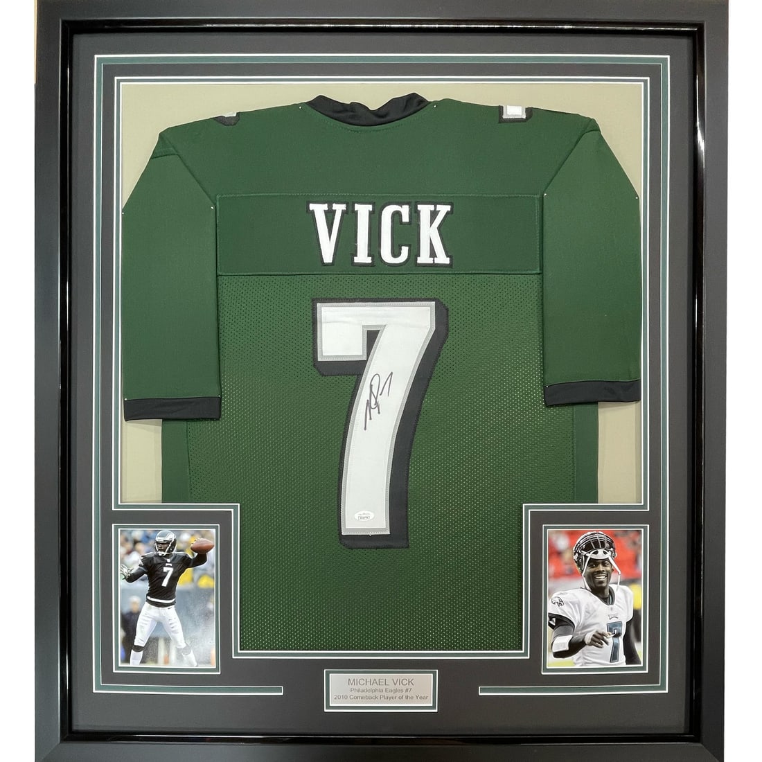 Framed Michael Vick signed Eagles jersey with PSA COA 33x42: Framed Michael Vick signed Eagles jersey with PSA COA 33x42 This professionally framed and matted Philadelphia Eagles green jersey features the authentic autograph of Michael Vick. The display include