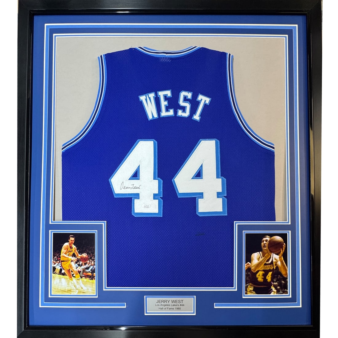 Framed Jerry West autographed Lakers retro jersey with JSA COA: Framed Jerry West autographed Lakers retro jersey with JSA COA This is a professionally framed and matted Los Angeles Lakers blue retro jersey autographed by Jerry West. The display includes two 8x10 