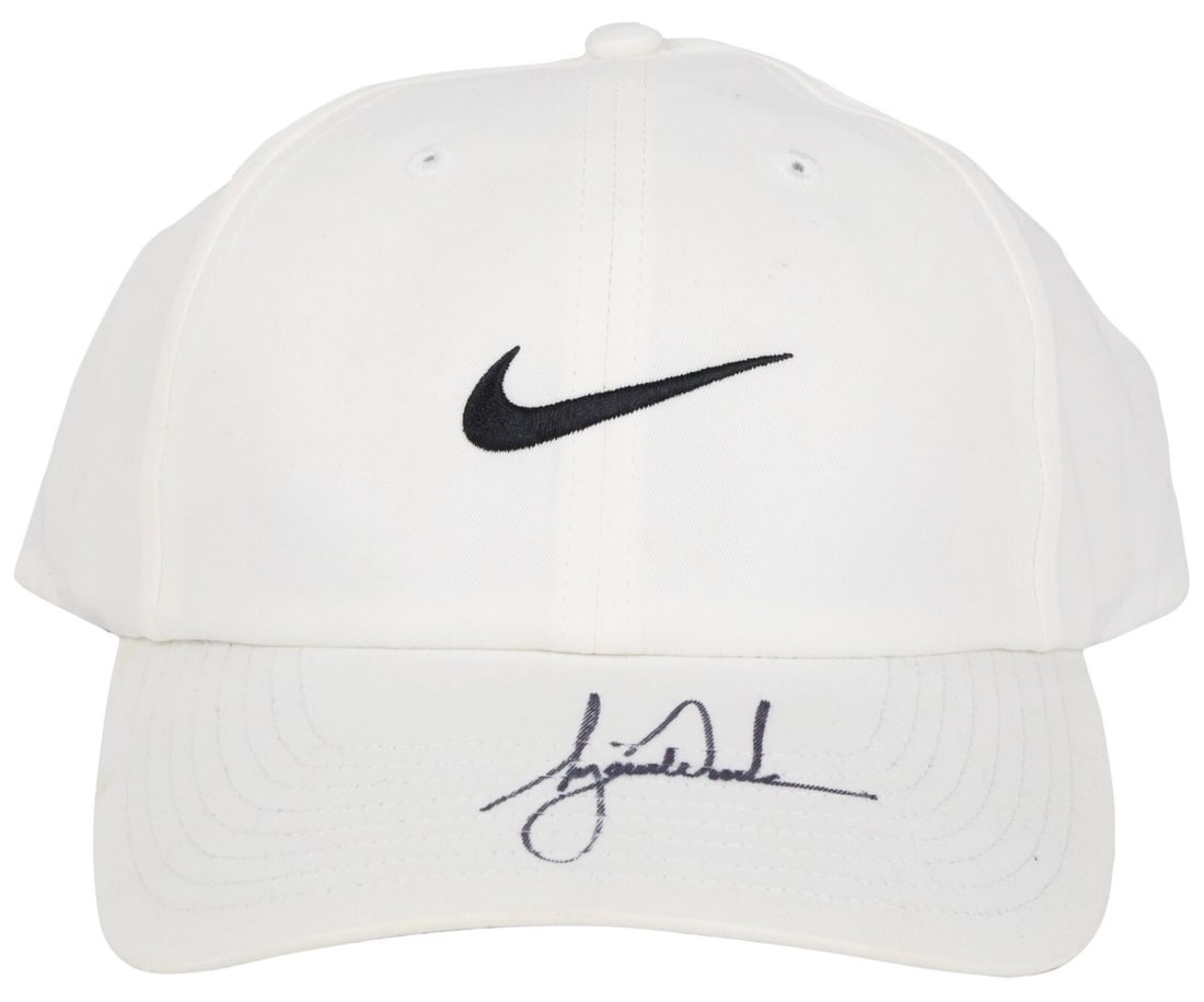 Tiger Woods Autographed Nike Golf Cap with PSA DNA Certification: Tiger Woods Autographed Nike Golf Cap with PSA DNA Certification This authentic Nike golf cap features the signature of Tiger Woods, one of the greatest golfers of all time. The cap has been signed on