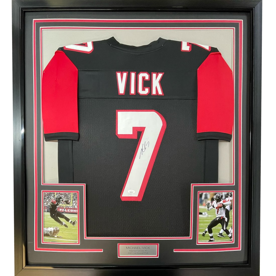 Framed Michael Vick Atlanta Falcons Jersey PSA COA 33x42: Framed Michael Vick Atlanta Falcons Jersey PSA COA 33x42 This professionally framed and matted Atlanta Falcons black jersey features the authentic autograph of Michael Vick. The display includes two 8