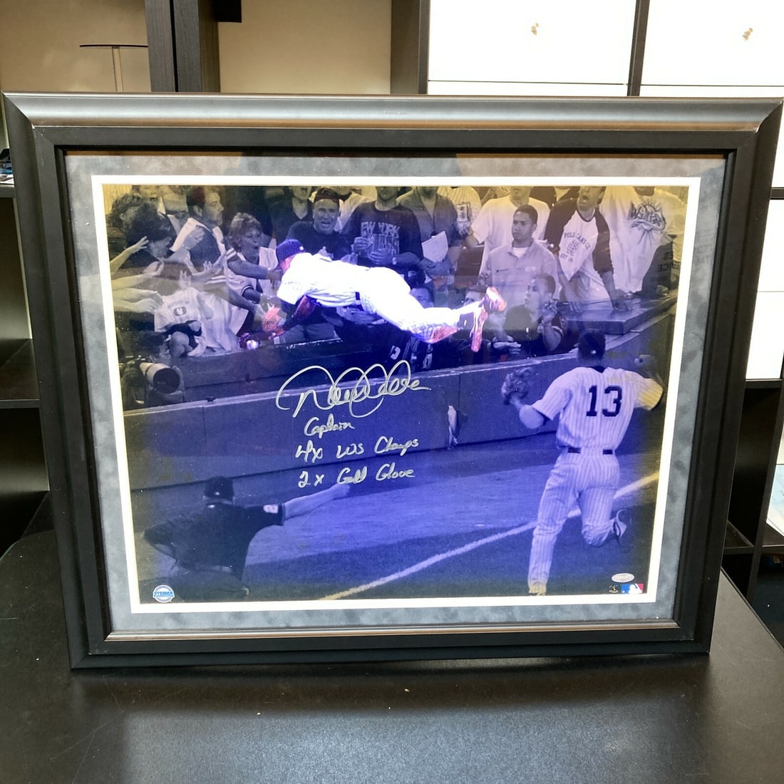 Derek Jeter Signed 21x25 Photo Inscribed Captain 4x WS Champs Steiner: Derek Jeter Signed 21x25 Photo Inscribed Captain 4x WS Champs Steiner This stunning 16x20 photo captures Derek Jeter's iconic catch against the Boston Red Sox on July 1st, 2004. The photograph is auto