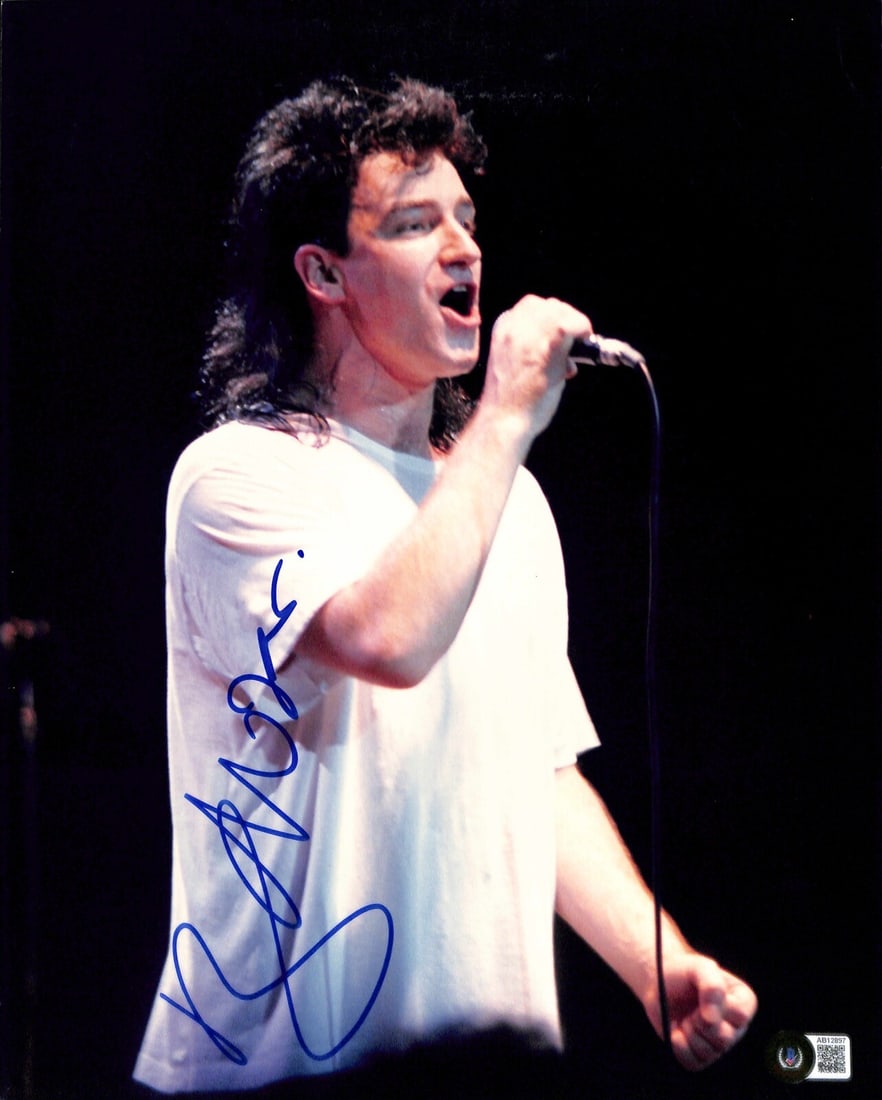 Bono Autographed 11x14 Color Photo With Beckett Authentication: Bono Autographed 11x14 Color Photo With Beckett Authentication This 11x14 color photograph features a permanent marker autograph from Bono, the lead singer and founder of U2. The autograph has been au