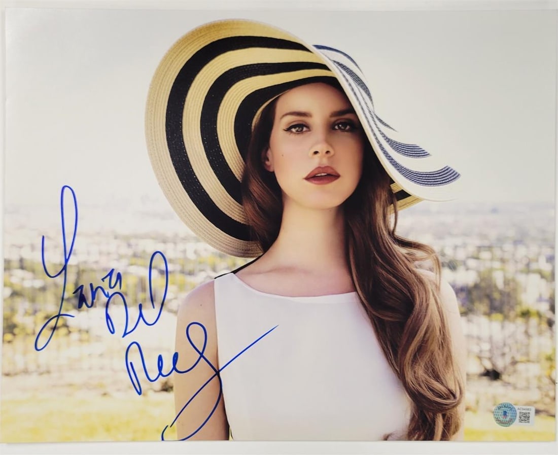 11x14 photograph signed by Lana Del Rey with full autograph Beckett authenticated: 11x14 photograph signed by Lana Del Rey with full autograph Beckett authenticated This is an original 11x14 photograph signed by singer Lana Del Rey, featuring her full autograph. The signature is aut