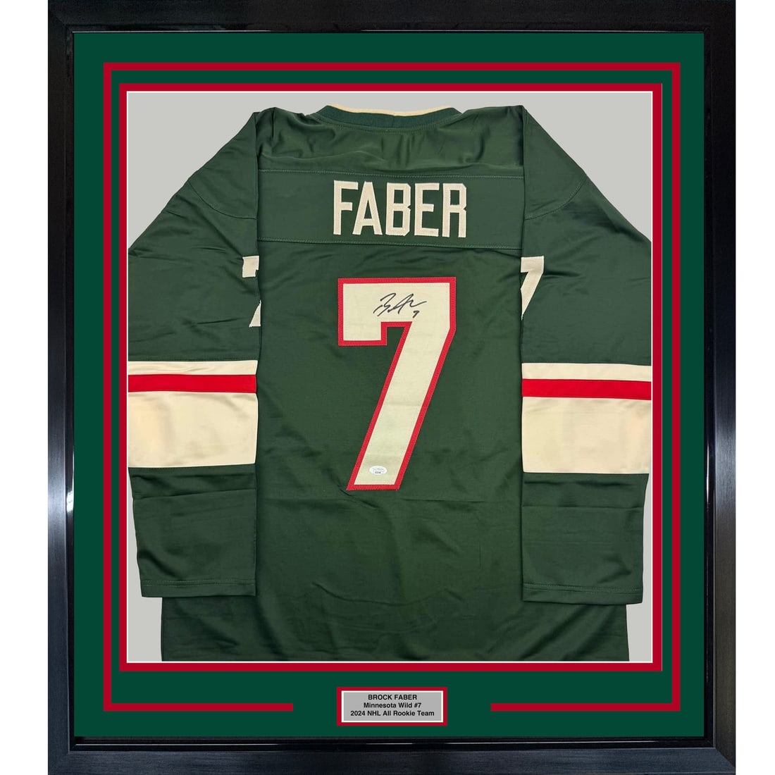 Framed Signed Brock Faber Minnesota Wild Jersey with JSA COA 35x39: Framed Signed Brock Faber Minnesota Wild Jersey with JSA COA 35x39 Celebrate your passion for hockey with this professionally framed and autographed Brock Faber Minnesota Wild jersey. Measuring an imp