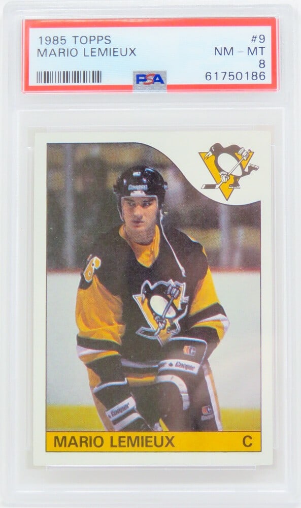 Mario Lemieux 1985 Topps RC #9 Graded PSA 8 Penguins Card: Mario Lemieux 1985 Topps RC #9 Graded PSA 8 Penguins Card Own a piece of ice hockey history with this Mario Lemieux Pittsburgh Penguins 1985 Topps Rookie Card #9. This card has been professionally gra