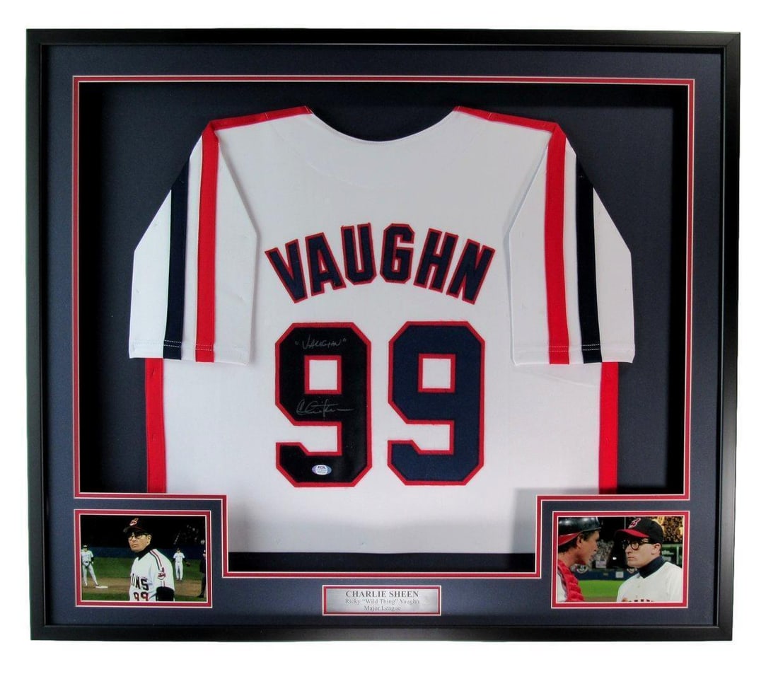PSA DNA framed Charlie Sheen Vaughn signed Major League jersey: PSA DNA framed Charlie Sheen Vaughn signed Major League jersey This framed display features a Charlie Sheen autographed and inscribed "Vaughn" baseball jersey from the movie "Major League." The jersey