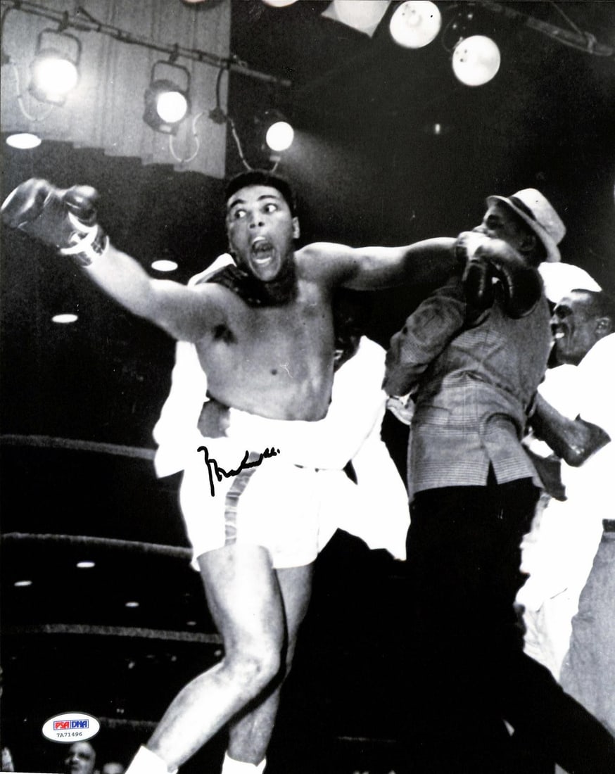 PSA DNA Auto 10 Muhammad Ali signed 11x14 boxing photo: PSA DNA Auto 10 Muhammad Ali signed 11x14 boxing photo This 11x14 photograph captures the iconic Clay versus Liston bout and is personally hand-signed by legendary boxer Muhammad Ali. The autograph ha