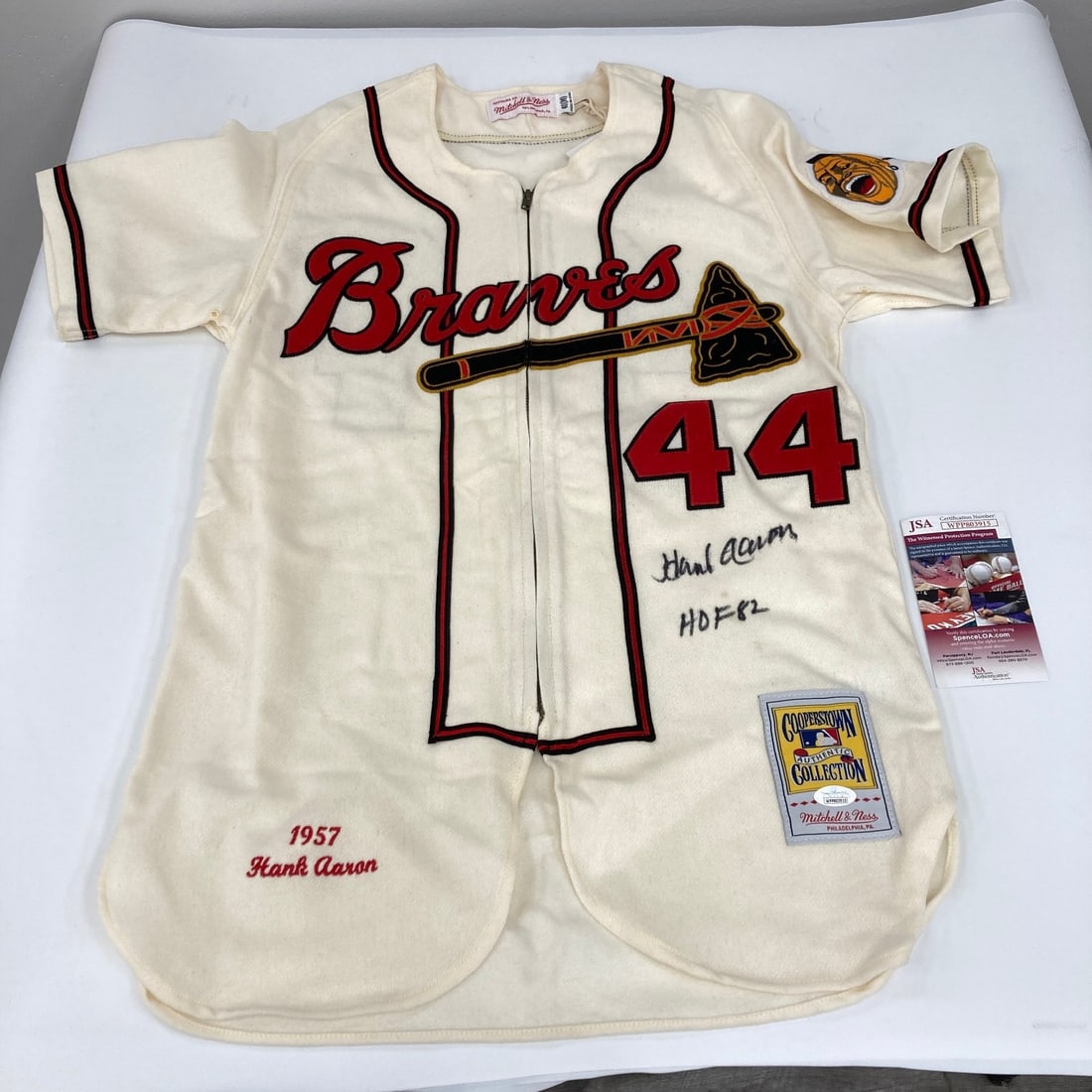 Hank Aaron Signed Milwaukee Braves Jersey Inscribed Hall Of Fame 1982 JSA COA: Hank Aaron Signed Milwaukee Braves Jersey Inscribed Hall Of Fame 1982 JSA COA This is an authentic Milwaukee Braves jersey by Mitchell & Ness, signed and inscribed "Hall Of Fame 1982" by Hank Aaron. T