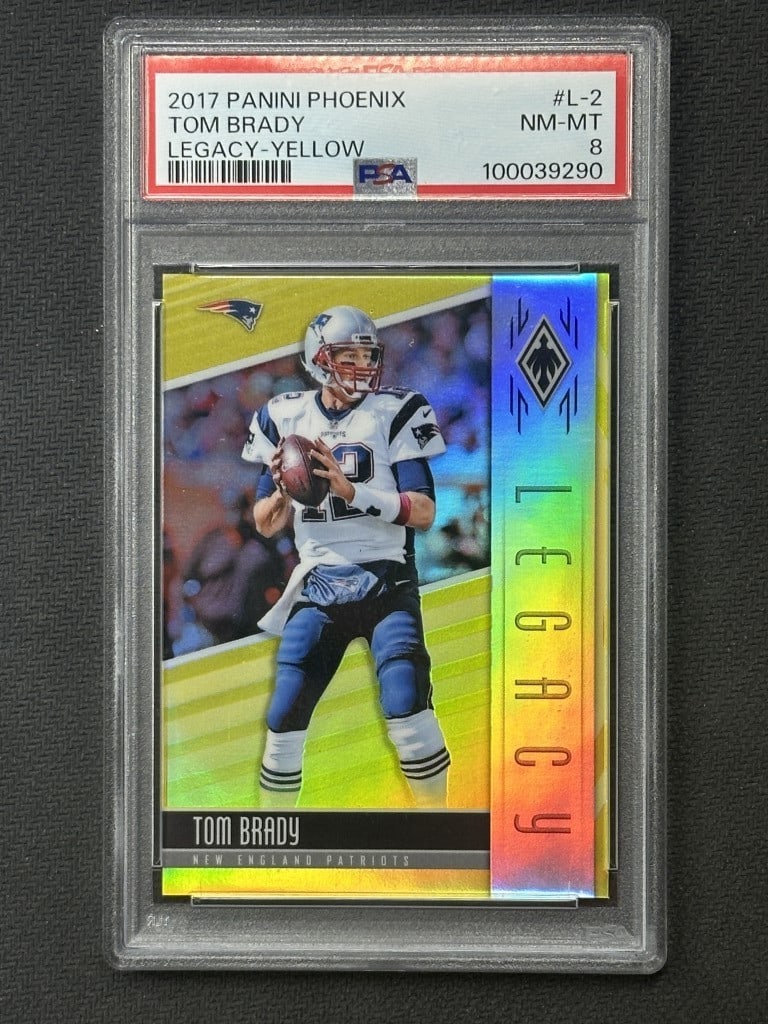 Tom Brady 2017 Panini Phoenix Legacy Yellow Jersey Card PSA 8 #L-2 Limited Edition: Tom Brady 2017 Panini Phoenix Legacy Yellow Jersey Card PSA 8 #L-2 Limited Edition This is a pre-owned 2017 Panini Phoenix Legacy Yellow Football Card featuring Tom Brady, graded PSA 8. This collectib