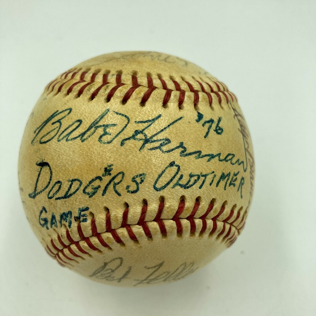 Signed Baseball with 12 Autographs 1976 Dodgers Old Timers Day JSA Letter: Signed Baseball with 12 Autographs 1976 Dodgers Old Timers Day JSA Letter This is an original baseball signed during the 1976 Los Angeles Dodgers Old Timers Day event. The ball features 12 signatures,