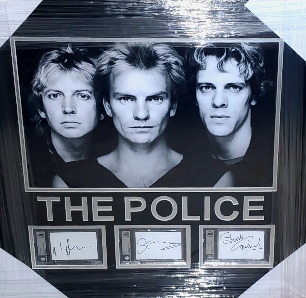 Framed The Police Signed Photo with Beckett Authentication 24x24: Framed The Police Signed Photo with Beckett Authentication 24x24 This framed display features original autographed cuts from all three members of The Police: Sting, Stewart Copeland, and Andy Summers.
