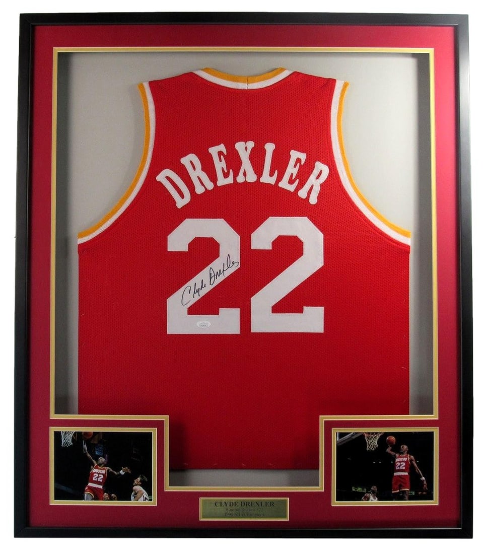 Framed Houston Rockets Jersey Signed by Clyde Drexler with JSA Authentication: Framed Houston Rockets Jersey Signed by Clyde Drexler with JSA Authentication This framed Houston Rockets custom basketball jersey features the authentic hand signature of Clyde Drexler. The jersey, i