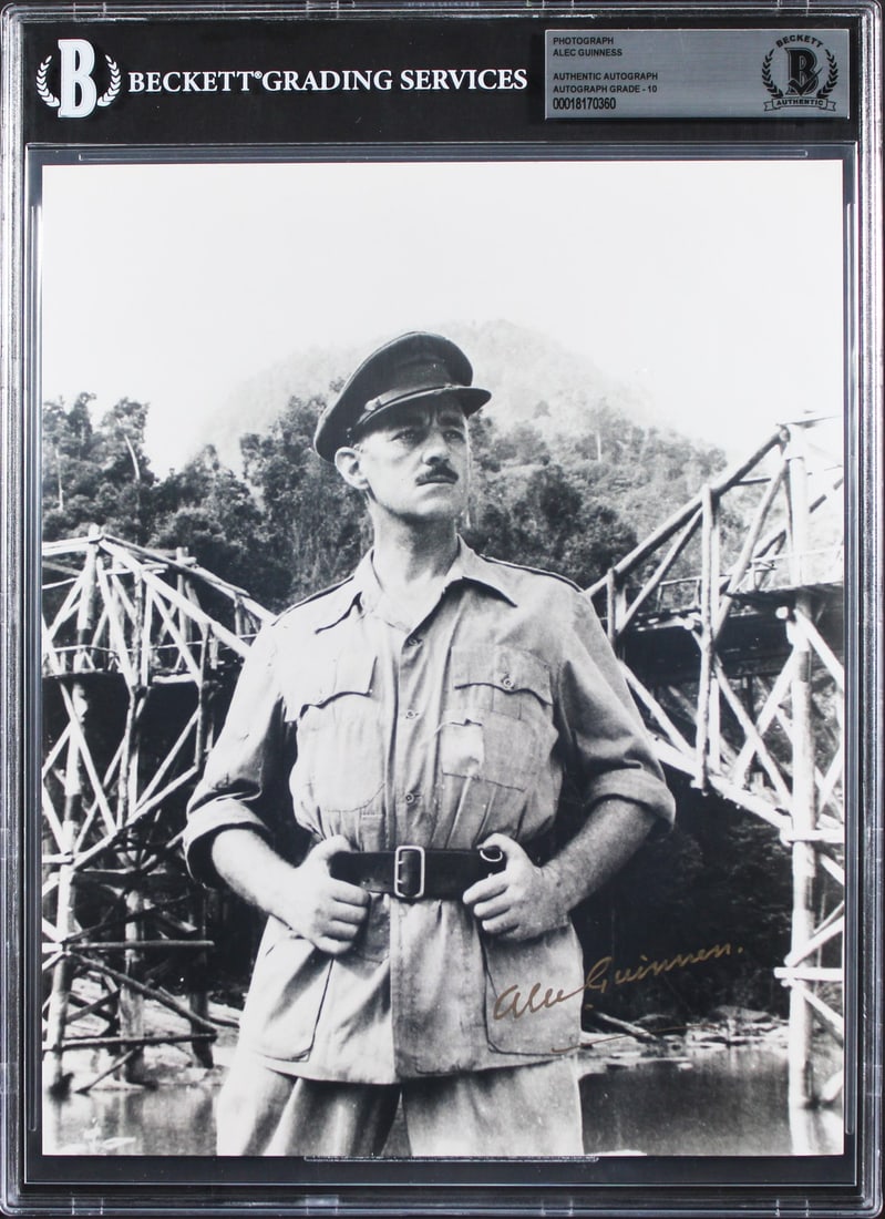 Alec Guinness Signed 8x10 Photo The Bridge on the River Kwai BAS Gem Mint 10: Alec Guinness Signed 8x10 Photo The Bridge on the River Kwai BAS Gem Mint 10 This stunning 8x10 photograph features the iconic Alec Guinness, personally signed and graded Gem Mint 10! The image is fro