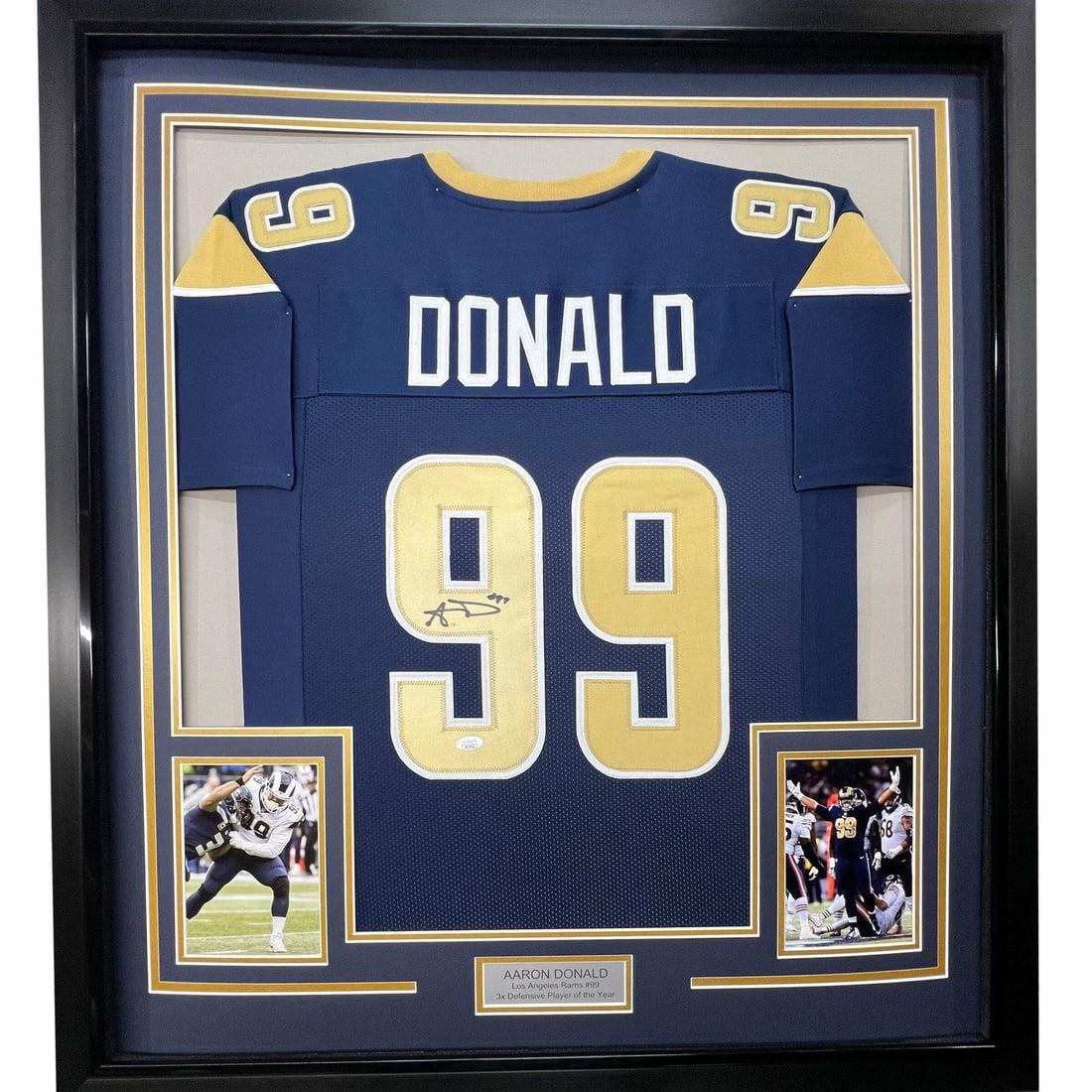 Framed Aaron Donald signed Rams jersey with JSA COA: Framed Aaron Donald signed Rams jersey with JSA COA This professionally framed and matted Los Angeles Rams blue jersey features the autograph of NFL player Aaron Donald. The display includes two 8x10 