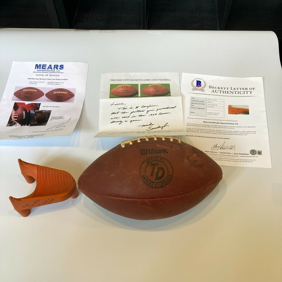 1968 Ohio State Buckeyes Game Used Football & Signed Kicking Tee: 1968 Ohio State Buckeyes Game Used Football & Signed Kicking Tee Celebrate the legacy of college football with this authentic game-used football from the 1968 Ohio State Buckeyes National Championship
