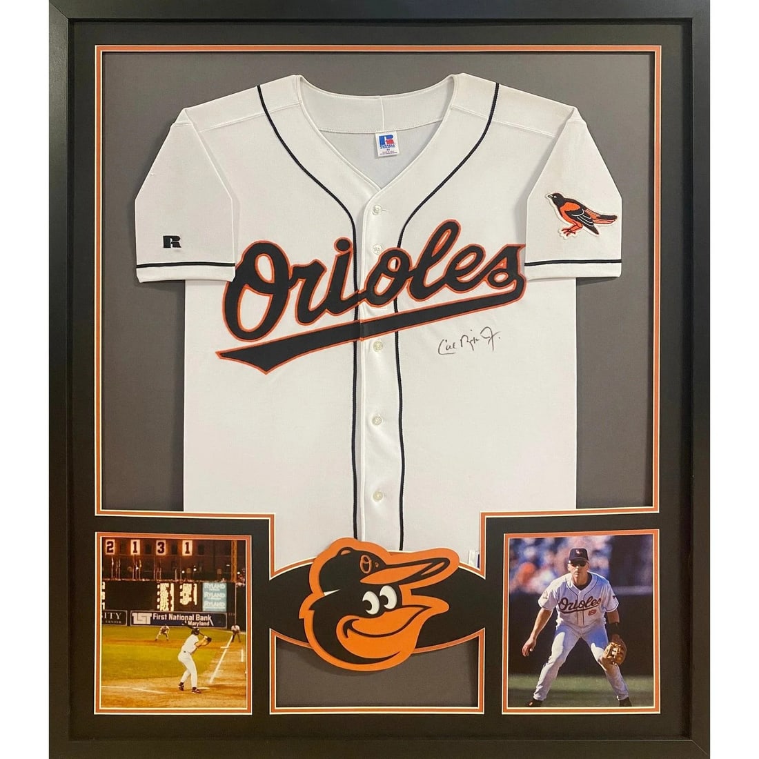 Framed Baltimore Orioles Jersey Signed by Cal Ripken Jr with JSA Authentication: Framed Baltimore Orioles Jersey Signed by Cal Ripken Jr with JSA Authentication This framed jersey features the authentic autograph of Cal Ripken Jr., a legendary player for the Baltimore Orioles. The
