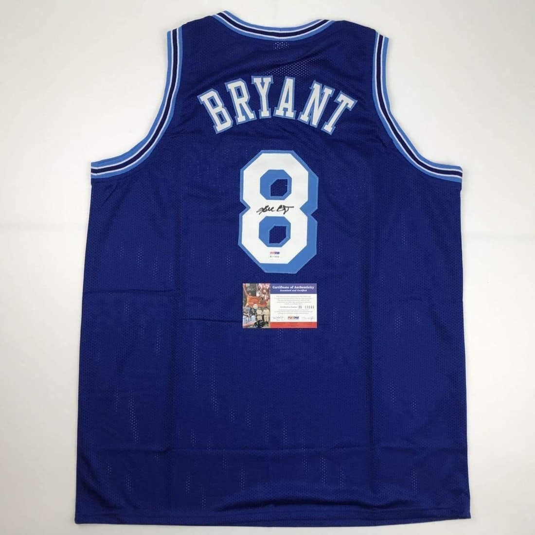 Kobe Bryant signed Lakers retro blue jersey PSA DNA COA: Kobe Bryant signed Lakers retro blue jersey PSA DNA COA This is a custom Los Angeles Lakers retro blue jersey featuring the name, number, and authenticated hand-signed autograph of Kobe Bryant. The au